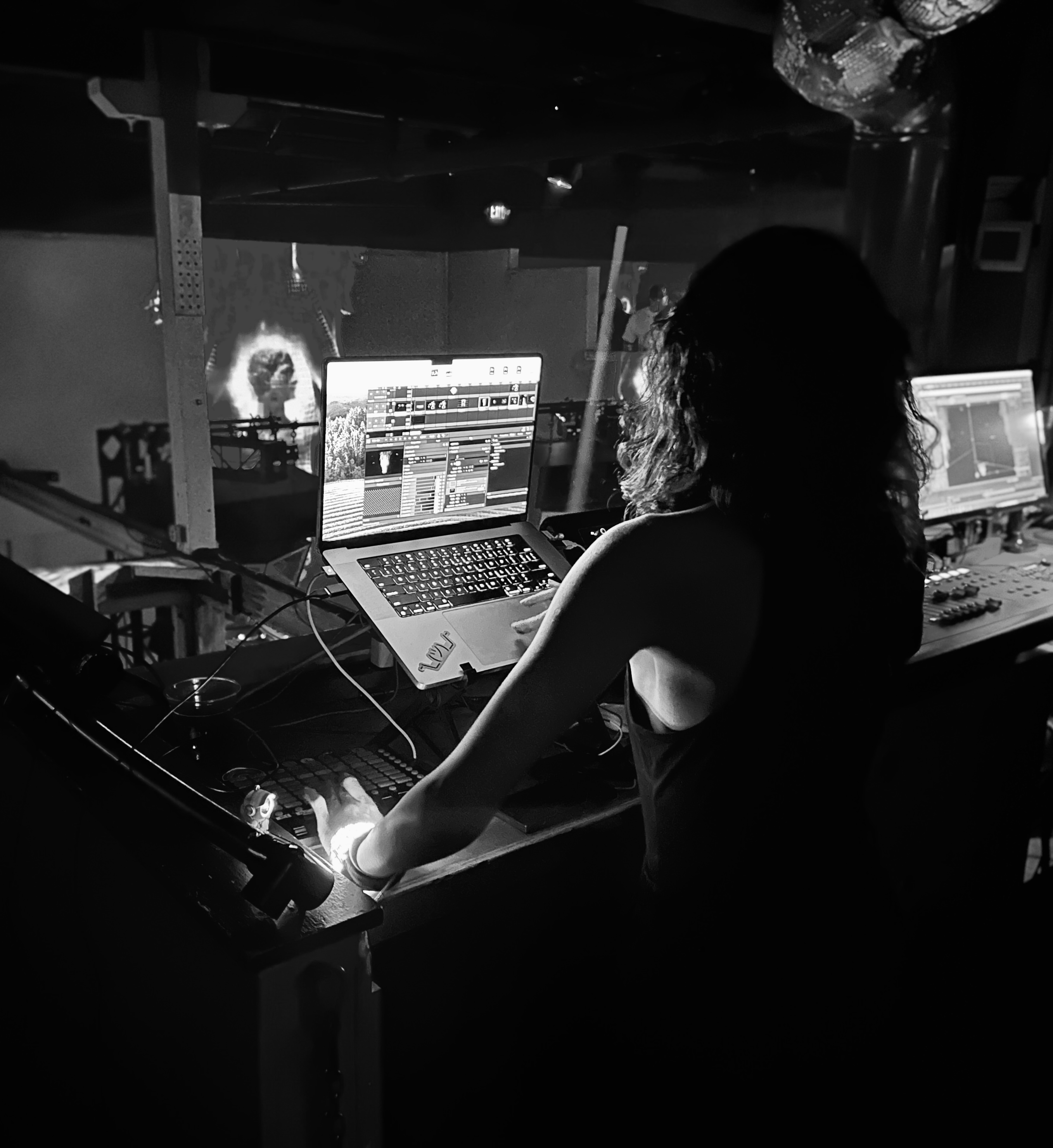 Asy Dhaif directing visuals at a show